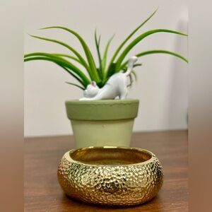 Costume gold cuff bracelet.